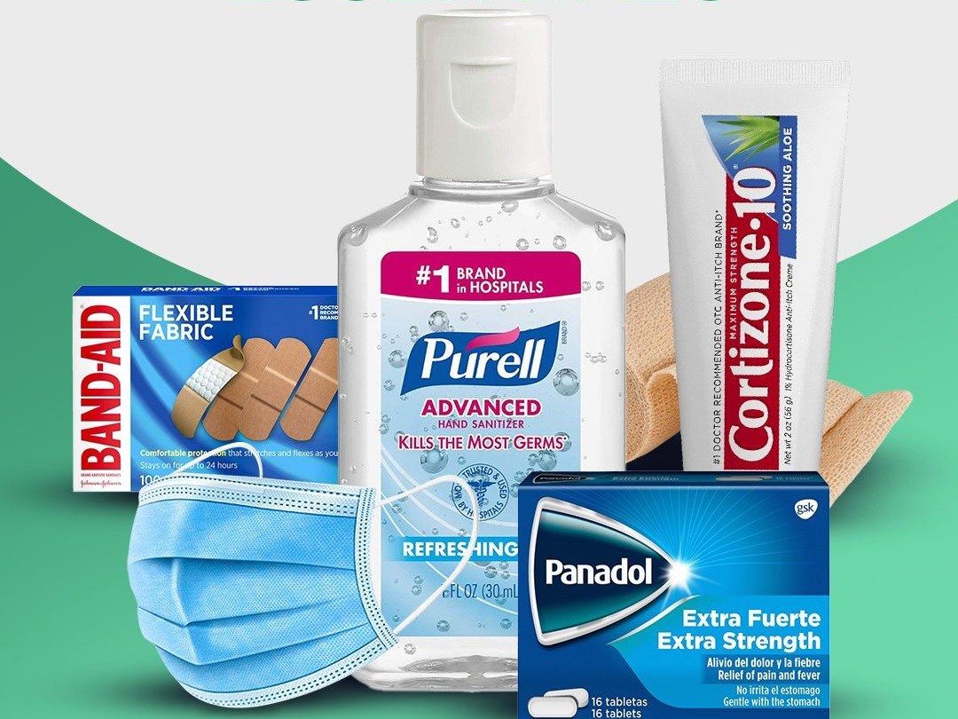 Shelf of over-the-counter essentials including bandages, hand sanitizer, antiseptic cream, and pain relief tablets