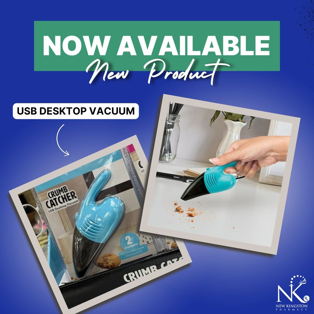 Small blue USB-powered desktop vacuum cleaning crumbs off a desk